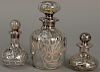 Three silver overlay cologne bottles. ht. 3in. to 5in.