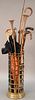 Group of canes, umbrellas, and two copper horns. lg. 39in.