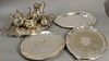 Group of silver plate to include five large silver plated trays and a four piece tea set, lg. 22in. to 28in.