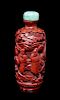 A Carved Cinnabar Lacquer Snuff Bottle, Height of bottle 3 inches.