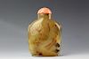 Chinese pale agate snuff bottle with coral stopper. Low relief carved lotus with mandarin ducks and crane. 19th century