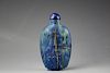 Chinese Lapis Lazuli snuff bottle with golden veins. Low relief carved figure of a lady seated beneath the tree of life with