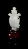 A Carved Jadeite Snuff Bottle, Height of bottle overall 2 7/8 inches.