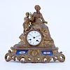 Antique French Gilt Bronze Figural Clock With Porcelain Panels