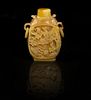 A Carved Hornbill Snuff Bottle, Height overall 2 3/4 inches.
