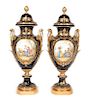 * A Pair of Sevres Gilt Bronze Mounted and Lidded Porcelain Urns Height 39 inches.