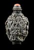 A Gilt and Grey Glazed Molded Porcelain Snuff Bottle Height 3 1/4 inches.