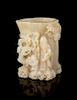 * A Carved White Jade Brushpot Height 7 1/4 inches.