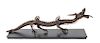 * An Articulated Wood Figure of a Dragon Length 28 inches.