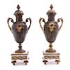 * A Pair of Continental Cast Metal Urns and Two Associated Stands Height 16 1/2 inches.