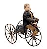 * A German Painted Tin "Tricycle Rider" Wind-Up Toy Height 9 inches overall.