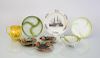 THREE ENGLISH GLAZED SHELL-FORM DISHES, TWO CABBAGE WARE PLATES AND A TRIPOD SIEVE, A WEDGWOOD CREAMWARE PLATE, AND A YELLOW 