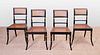 SET OF FOUR REGENCY EBONIZED, PARCEL-GILT AND CANED SIDE CHAIRS