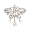 * An Edwardian Platinum Topped 18 Karat Yellow Gold, Diamond and Pearl Brooch, 8.30 dwts.
