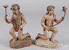 Pair of carved and painted figural candleholders