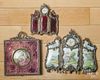 Two desk clocks, a frame and a medallion