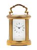 A Swiss Gilt Brass Carriage Clock Height 4 inches.