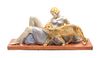 A Continental Ceramic Figural Group Height 8 x width 16 3/4 x depth 4 1/2 inches.