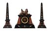 A French Egyptian Revival Three-Piece Clock Garniture Height of obelisk 20 1/4 inches.