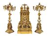 A French Gothic Revival Gilt Bronze Clock Garniture Height of mantel clock 31 3/4 inches.