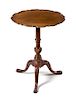 A George II Mahogany Tripod Tablecirca 1755in the Chippendale taste, the top having a shaped piecrust edge and supported on a