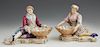 Pair of Meissen Style Figural Polychromed Porcelain Sweetmeat Dishes, 20th c., modeled as a couple in 19th c. costume holding