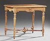 French Louis Philippe Style Carved Walnut Writing Table, early 20th c., the stepped shaped top over an arched skirt with a fr