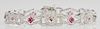 14K White Gold Art Deco Style Link Bracelet, each of the twelve pierced links mounted with a princess cut ruby within a diamo