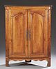 Louis XV Style Carved Cherry Corner Cabinet, 19th c., the rounded corner top over double fielded panel doors with iron escutc