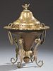 Moroccan Brass Brazier, early 20th c., the lid with an eagle handle over a scalloped top hung with large ring handles, on fou