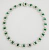 18K White Gold Art Deco Style Link Necklace, each of the twenty-four elaborate links with a central emerald atop a geometric 