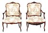 A Pair of Louis XV Style Carved Walnut Fauteuils a La Reine Height 46 1/2 x width 27 x depth 23 inches.