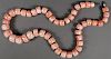 AN IMPRESSIVE CARVED PINK CORAL NECKLACE