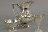 Three piece lot to include sterling silver pitcher (ht. 8 in.), Hardy Bros. Ltd. sugar and creamer. 25.5 troy ounces   Proven
