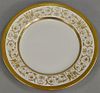 Set of eleven England Crown plates with raised gold borders. dia. 10 1/4 in.   Provenance: The Estate of Thomas F Hodgman of 
