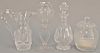 Four crystal pieces to include Waterford decanter, cut crystal pitcher, sugar bowl (ht. 9in.), and an etched glass vase on re