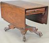 Empire mahogany drop leaf table with paw feet, solid top. ht. 28 in., top closed: 22" x 40"