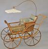 Wicker carriage with lacy parasol "The Heywood". ht. 54 in., total lg. 56 in.  Provenance: Property from the Estate of Frank 