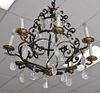 Rock crystal and iron chandelier with eight lights, approximate ht. 24in., dia. 24in. (Two bulbs as is)   Provenance: The Est
