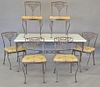 Iron patio table and six chairs, table topped with corian, chairs with custom cushions. ht. 30 in., top: 36" x 63"
