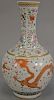 Famille rose globular dragon vase with flaming clouds having a six character mark on bottom. ht. 19in.