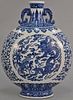 Blue and white dragon moon flask having painted scrolling vines and flowers around central round painted panel with five claw