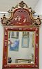 Chinoiserie decorated red framed mirror. 55" x 35"