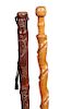 1. A Pair of Folk Art Canes-Early 20th Century-One has a carved head with a salamander and snake-elephant and the other is g