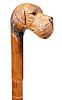 24. Folk Art Dog Cane-  Early 20th Century-A carved dog with two color glass eyes, hardwood shaft, never had a ferrule.H.-