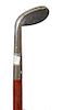 29. Golf System Cane-  Ca 1980- A “Sunday Stick” which has a wedge rather than a putter, mahogany shaft and a metal fer