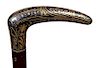 4. Toledo Dress Cane-  Ca. 1900- A nice Toledo style handle with minor ware, exotic wood shaft and a metal ferrule. H.- 4 