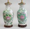 TWO SIMILAR CHINESE FAMILLE ROSE STYLE PORCELAIN BALUSTER-FORM VASES, MOUNTED AS LAMPS