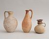 THREE CYPRIOT POTTERY EWERS