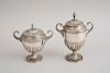 TWO SIMILAR GRADUATED SILVER URNS AND COVERS